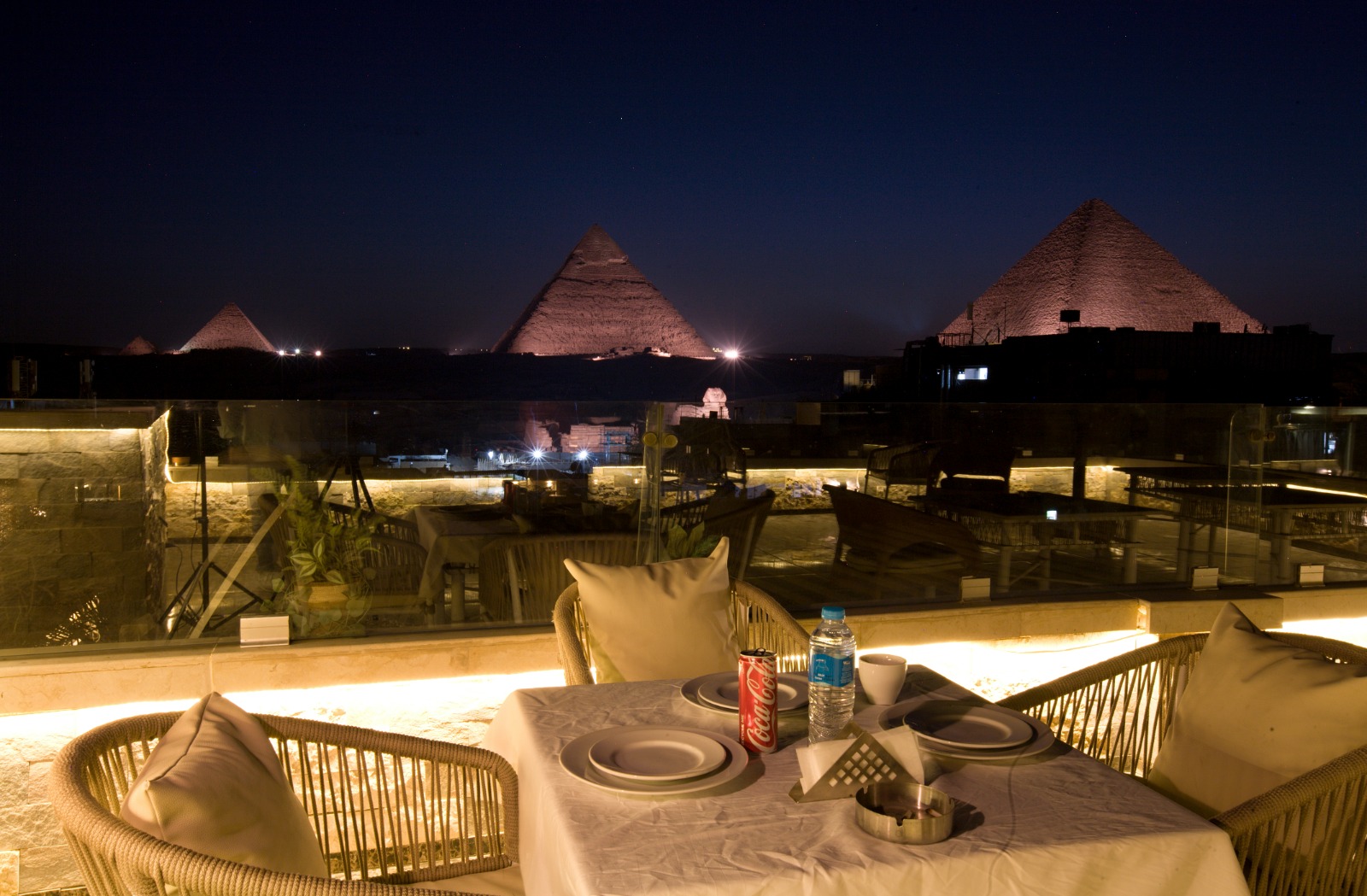 Pyramids at night from rooftop terrace